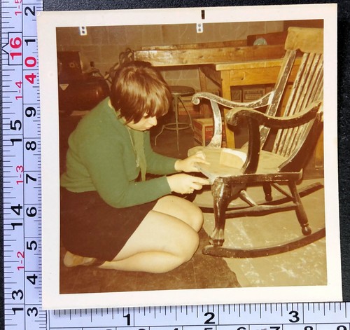 Young woman restoring wooden - a,
